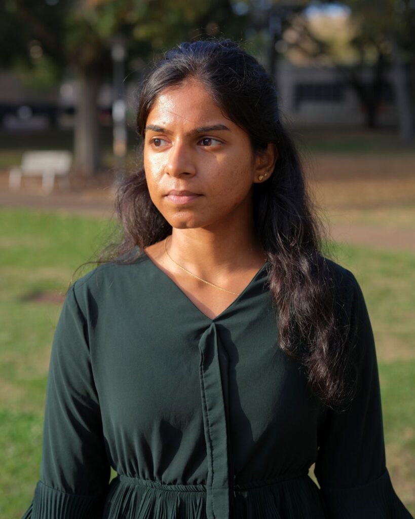 Image of engineering student Sai Sushma Pasupulet. She's dressed in green