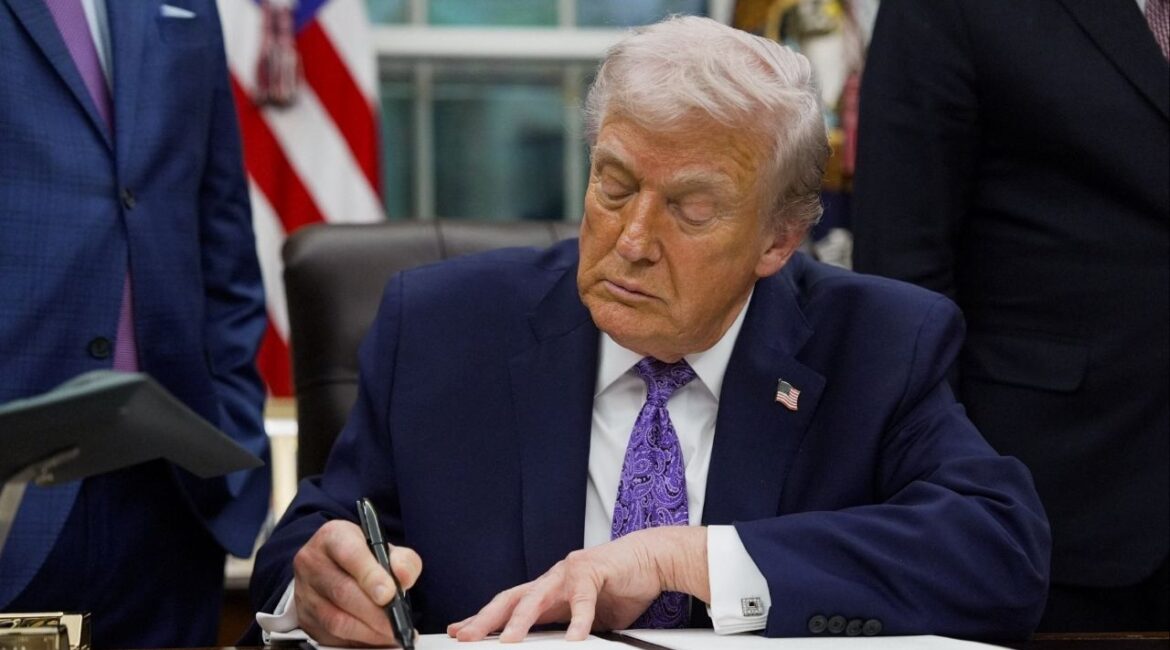 President Donald Trump signs an executive order on AI, in the Oval Office at the White House in Washington, D.C., U.S. December 11, 2025. (Reuters/Al Drago)
