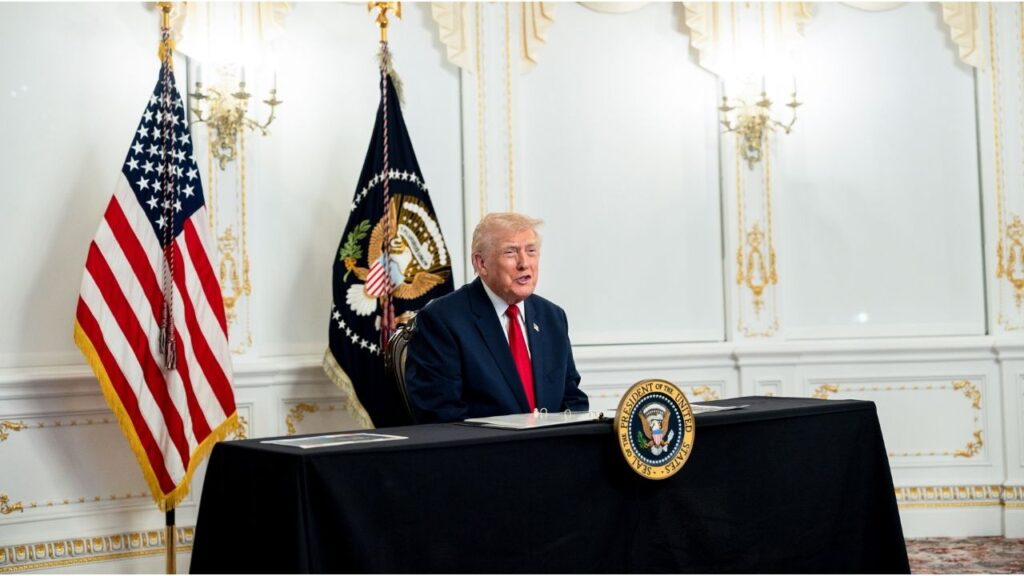 President Donald Trump speaks to reporters after participating in a video call with military service members from his Mar-a-Lago residence in Palm Beach, Fla., on Thanksgiving, Thursday, Nov. 27, 2025. President Trump has set free a private equity executive who served less than two weeks of a seven-year sentence for his role in what prosecutors described as a $1.6 billion scheme that defrauded thousands of victims. (Tierney L. Cross/The New York Times)