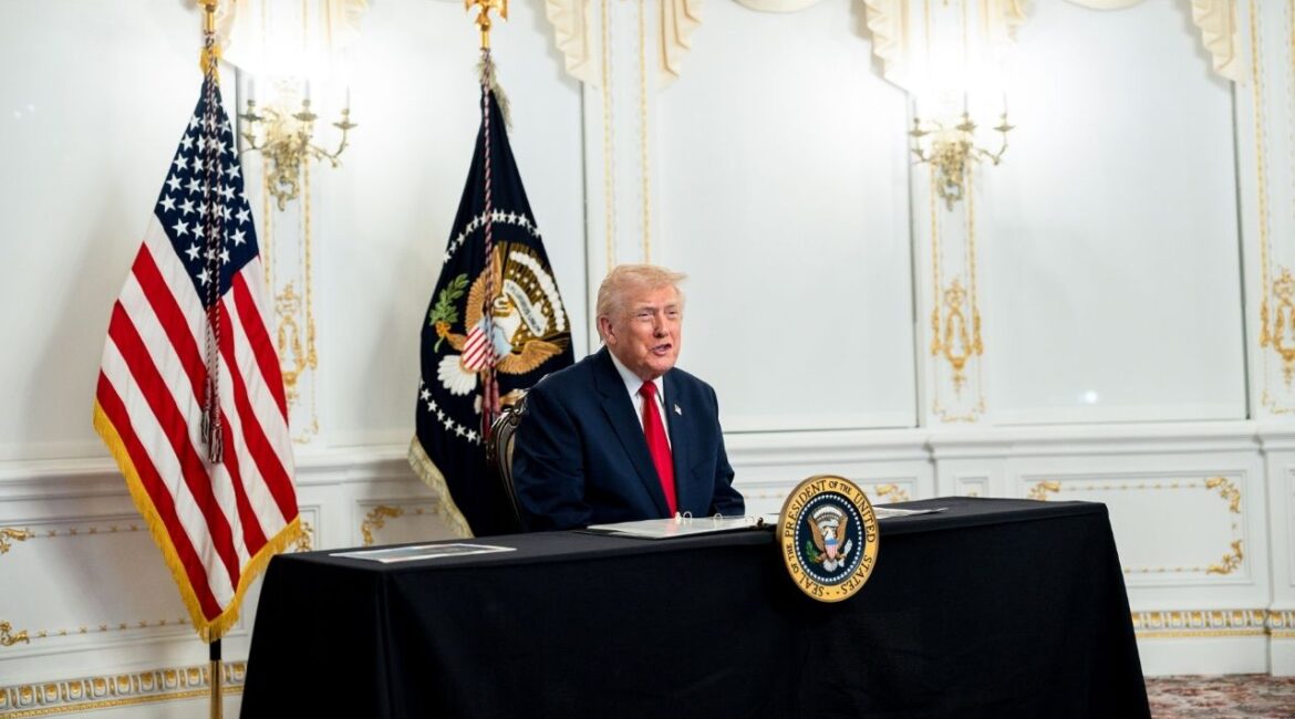 President Donald Trump speaks to reporters after participating in a video call with military service members from his Mar-a-Lago residence in Palm Beach, Fla., on Thanksgiving, Thursday, Nov. 27, 2025. President Trump has set free a private equity executive who served less than two weeks of a seven-year sentence for his role in what prosecutors described as a $1.6 billion scheme that defrauded thousands of victims. (Tierney L. Cross/The New York Times)