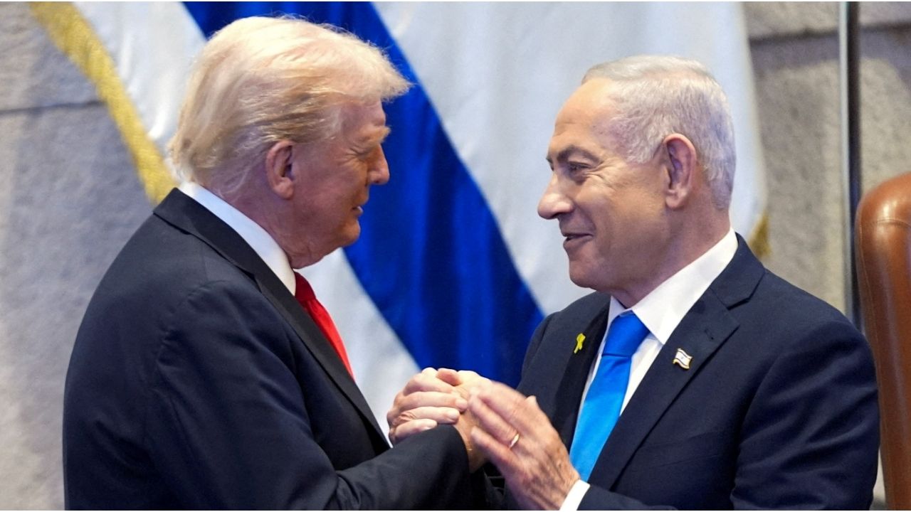 President Donald Trump talks with Israel's Prime Minister Benjamin Netanyahu at the Knesset, Monday, Oct. 13, 2025, in Jerusalem. (Evan Vucci/Pool via Reuters)