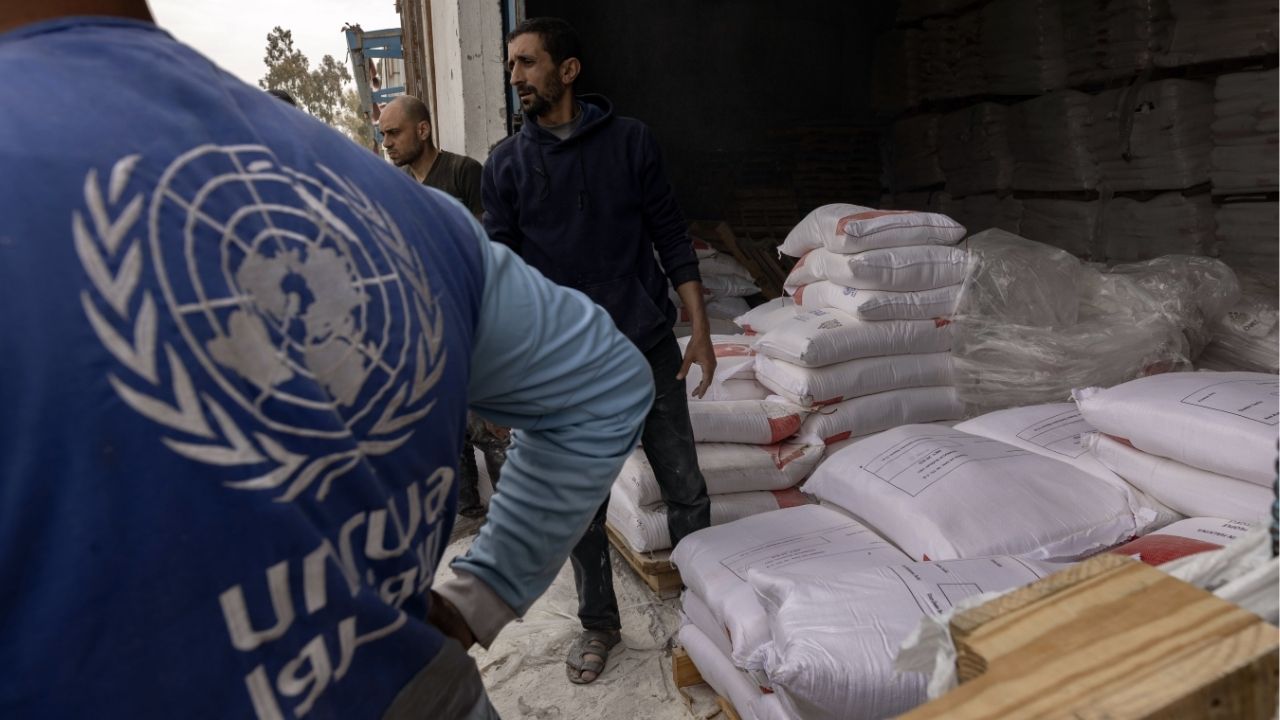 Sacks of flour are distributed in Gaza City from a center run by the United Nations Relief and Works Agency — widely known as UNRWA — on April 1, 2025. Israel’s Parliament passed new legislation on Monday, Dec. 29, 2025, formally removing diplomatic immunity from the agency. (Saher Alghorra/The New York Times)