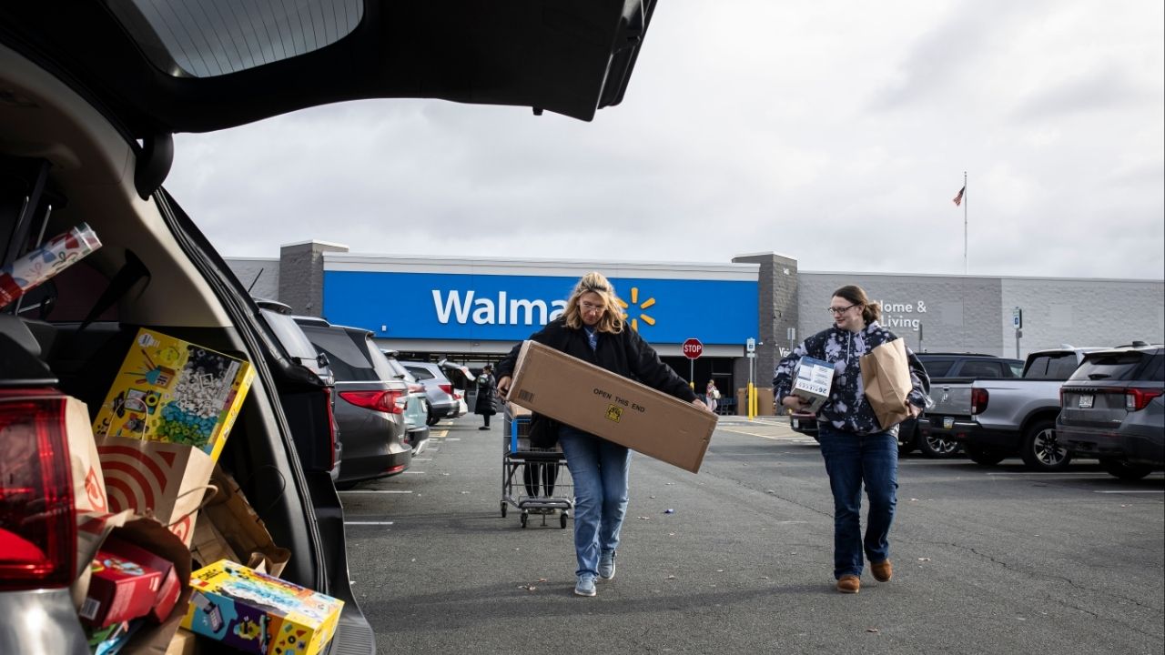 Shoppers outside a Walmart in Albany, N.Y. on Black Friday morning, Nov. 28, 2025. For most people, the tax cuts that President Donald Trump signed into law this summer have yet to materialize. But Walmart and many more of America’s largest companies have not had to wait. (Dave Sanders/The New York Times)