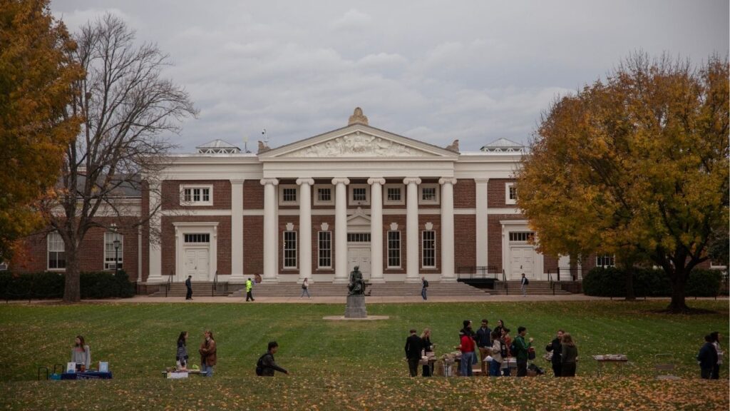Students on the grounds of the University of Virginia in Charlottesville, Va., Oct. 28, 2025. The Justice Department sued Virginia on Monday over its policy of granting unauthorized immigrants in-state financial aid at public colleges and universities, saying that the assistance violates federal law because it discriminates against U.S. citizens living in other states. (Kirsten Luce/The New York Times)