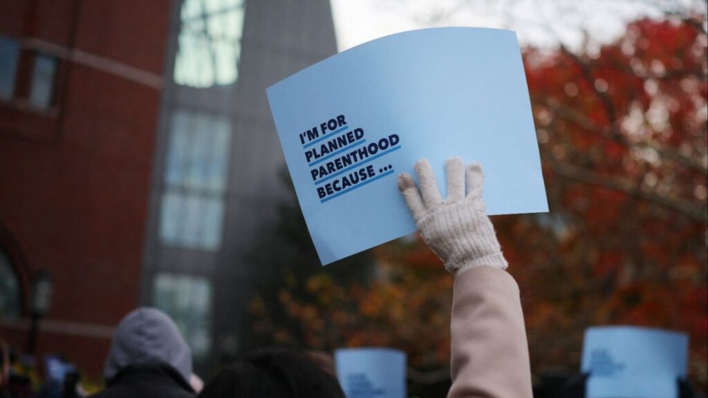 Supporters attend a rally outside the federal courthouse where a federal appeals court will consider whether U.S. President Donald Trump's administration may implement a provision that would deprive Planned Parenthood and its members of Medicaid funding, in Boston, Massachusetts, U.S., November 12, 2025. (Reuters/Brian Snyder)