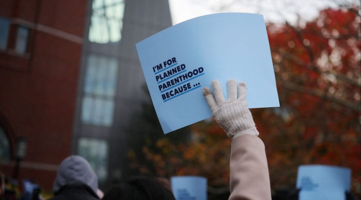 Supporters attend a rally outside the federal courthouse where a federal appeals court will consider whether U.S. President Donald Trump's administration may implement a provision that would deprive Planned Parenthood and its members of Medicaid funding, in Boston, Massachusetts, U.S., November 12, 2025. (Reuters/Brian Snyder)