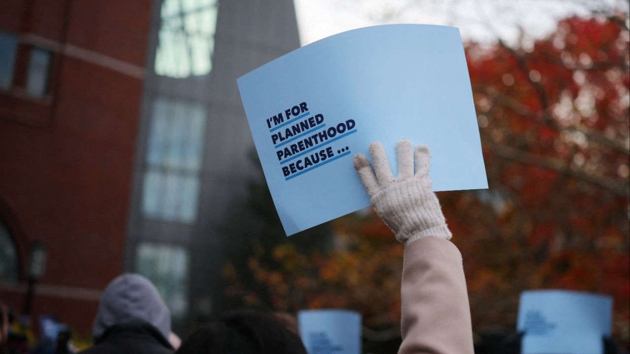 Supporters attend a rally outside the federal courthouse where a federal appeals court will consider whether U.S. President Donald Trump's administration may implement a provision that would deprive Planned Parenthood and its members of Medicaid funding, in Boston, Massachusetts, U.S., November 12, 2025. (Reuters/Brian Snyder)