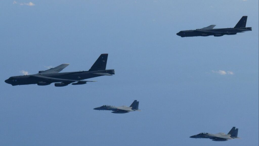The 6th Air Wing of Japan Air Self-Defense Force's F-15 fighters hold a joint military drill with the U.S. B-52 bombers over Sea of Japan, in this handout picture taken by Japan Air Self-Defence Force and on December 10, 2025, and released by the Joint Staff Office of the Defense Ministry of Japan on December 11, 2025. (Joint Staff Office of the Defense Ministry of Japan/Handout via Reuters)