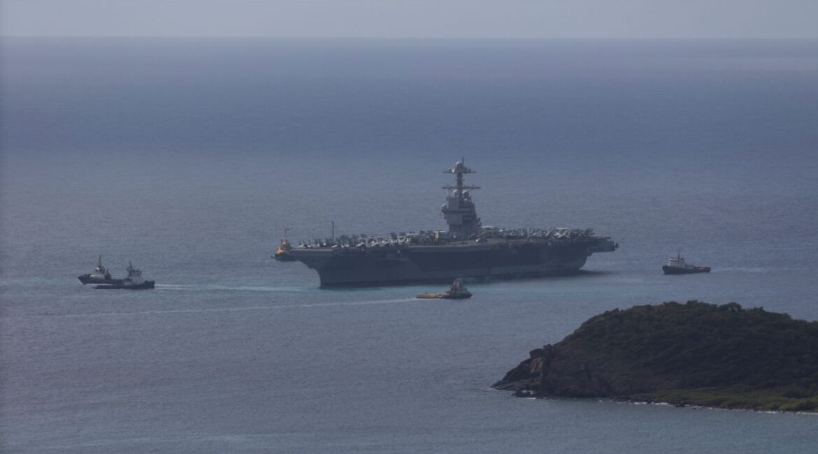 The U.S. Navy USS Gerald R. Ford aircraft carrier (CVN-78) is moved by tug boats near Saint Thomas, U.S. Virgin Islands, December 1, 2025. (Reuters/Marco Bello)