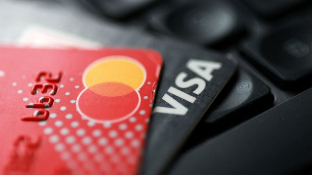 Visa and Mastercard cards are placed on a keyboard in this illustration taken September 24, 2025. (Reuters/Dado Ruvic/Illustration)