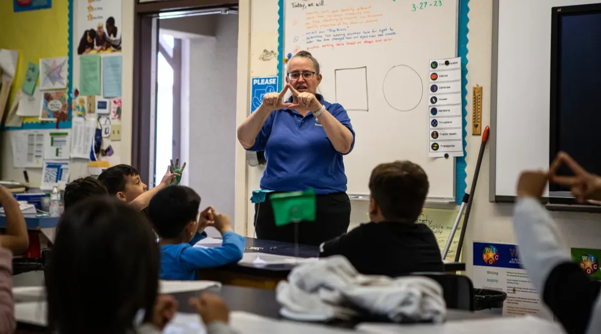 Image of a kindergarten teacher teaching shapes to her students
