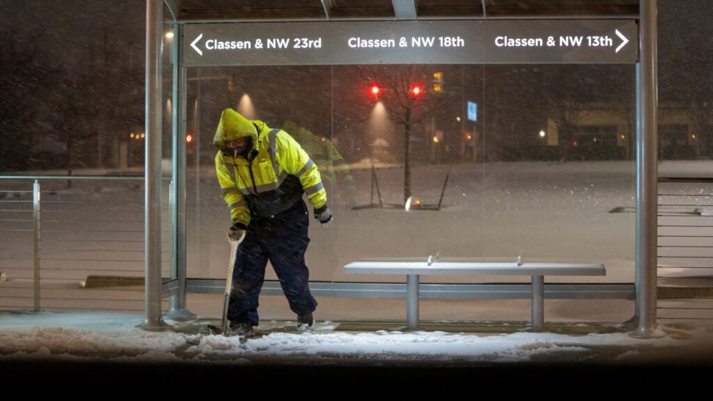 Image of a worker in a yellow cold suit working outside