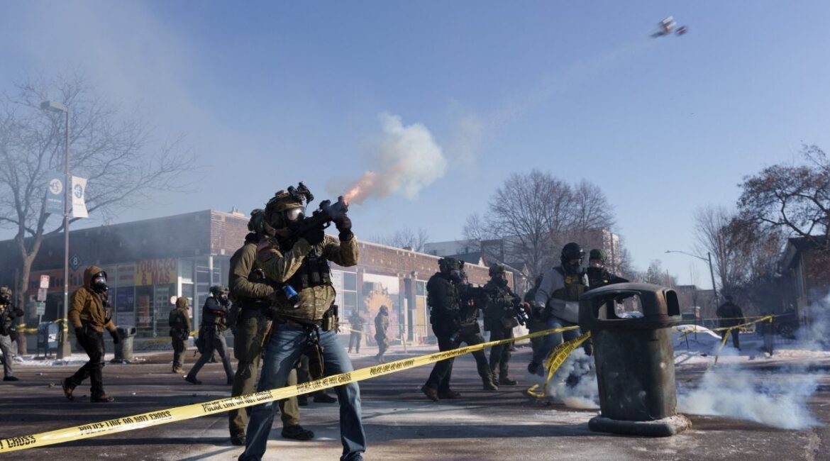 A federal agent fires a munition toward demonstrators near the site where a man identified as Alex Pretti was fatally shot by federal agents trying to detain him, in Minneapolis, Minnesota, U.S., January 24, 2026. (Reuters/Tim Evans)