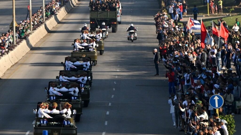 A motorcade transports the Cuban‑flag‑draped urns of soldiers killed in the U.S. strike and the capture of President Nicolas Maduro and his wife, Cilia Flores, in Caracas on January 3, as Cuba honors them with a caravan through Havana on January 15, 2026. (Reuters/Norlys Perez)