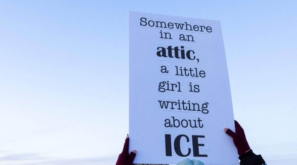A person raises a sign in protest against U.S. Customs Enforcement and Immigration (ICE) during a demonstration outside a dormant prison that is under contract to become an ICE detention center in Hudson, Colorado, U.S., January 21, 2026. (Reuters/Kevin Mohatt)
