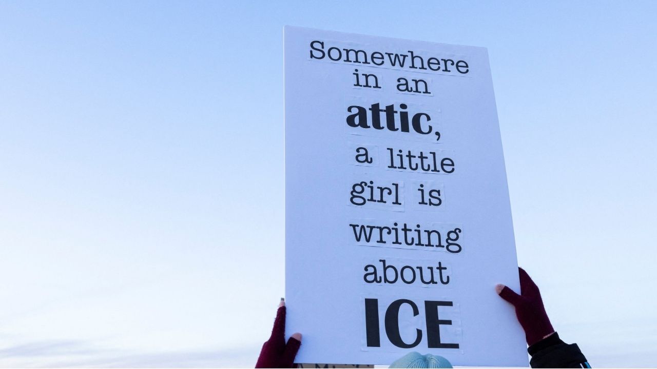 A person raises a sign in protest against U.S. Customs Enforcement and Immigration (ICE) during a demonstration outside a dormant prison that is under contract to become an ICE detention center in Hudson, Colorado, U.S., January 21, 2026. (Reuters/Kevin Mohatt)