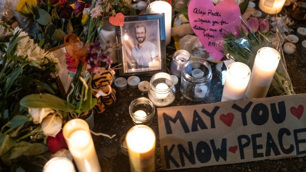 A photo of Alex Pretti is displayed at a makeshift memorial at the site where he was shot and killed by ICE agents in Minneapolis, Jan. 26, 2026. (Victor J. Blue/The New York Times)