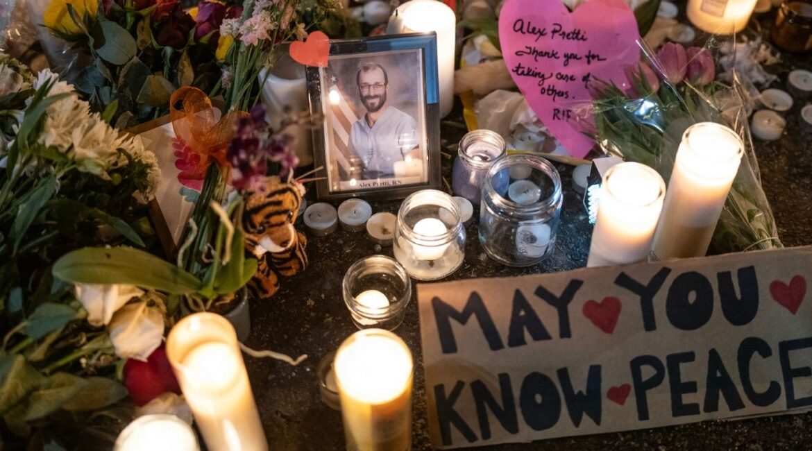 A photo of Alex Pretti is displayed at a makeshift memorial at the site where he was shot and killed by ICE agents in Minneapolis, Jan. 26, 2026. (Victor J. Blue/The New York Times)