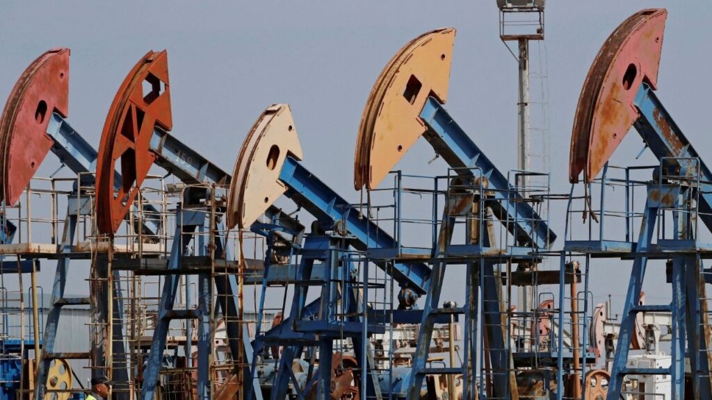 A security guard stands near disused oil pump jacks at the Airankol oil field operated by Caspiy Neft in the Atyrau Region, Kazakhstan August 22, 2024. (Reuters/Pavel Mikheyev)