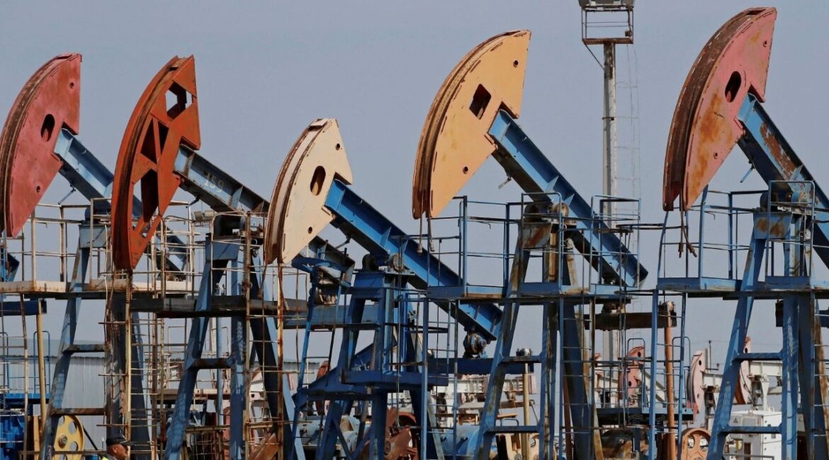 A security guard stands near disused oil pump jacks at the Airankol oil field operated by Caspiy Neft in the Atyrau Region, Kazakhstan August 22, 2024. (Reuters/Pavel Mikheyev)