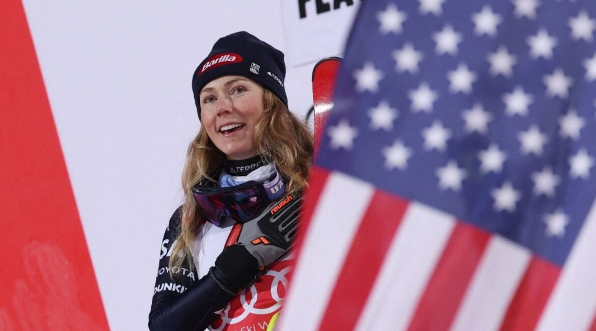 Alpine Skiing - FIS Alpine Ski World Cup - Women's Night Slalom - Flachau, Austria - January 13, 2026 Mikaela Shiffrin of the U.S celebrates on podium after winning the Women's Slalom (Reuters/Gintare Karpaviciute)