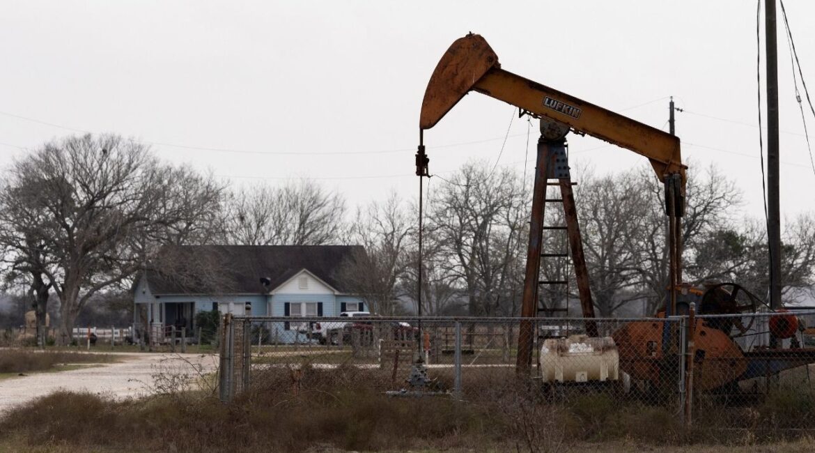 An oil pumpjack in front of a house in Ganado, Texas, U.S., January 8, 2026. (Reuters/Antranik Tavitian)