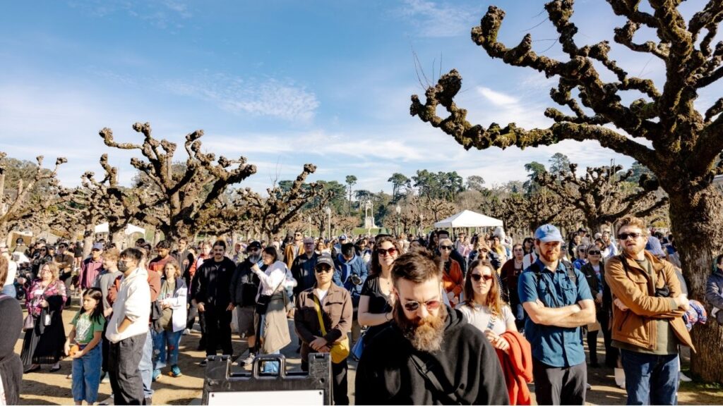 Attendees during Claude the alligator's funeral at Golden Gate Park in San Francisco, on Sunday, Jan. 18, 2026. The pink-eyed, 300-pound resident of the California Academy of Sciences died last month. On Sunday, thousands paid tribute. (Poppy Lynch/The New York Times)