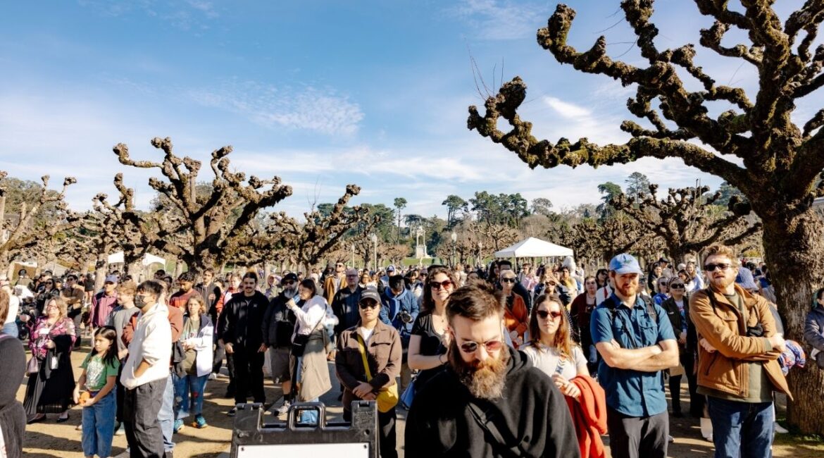 Attendees during Claude the alligator's funeral at Golden Gate Park in San Francisco, on Sunday, Jan. 18, 2026. The pink-eyed, 300-pound resident of the California Academy of Sciences died last month. On Sunday, thousands paid tribute. (Poppy Lynch/The New York Times)