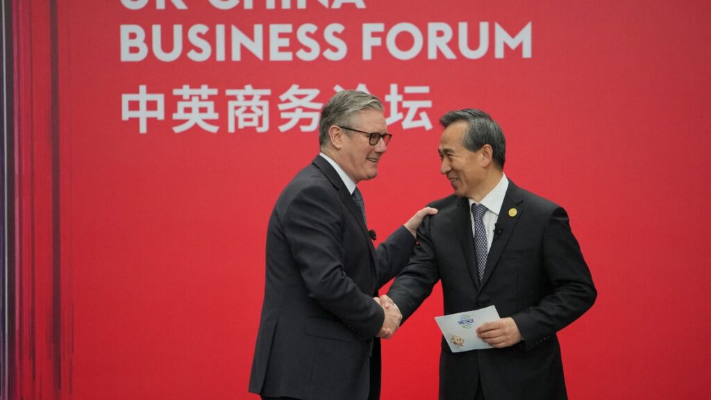 Britain's Prime Minister Keir Starmer shakes hands with Ren Hongbin, Chairman of the China Council for the Promotion of International Trade (CCPIT) during the UK-China Business Forum in Beijing, China, January 30, 2026 . (Carl Court/Pool via Reuters)