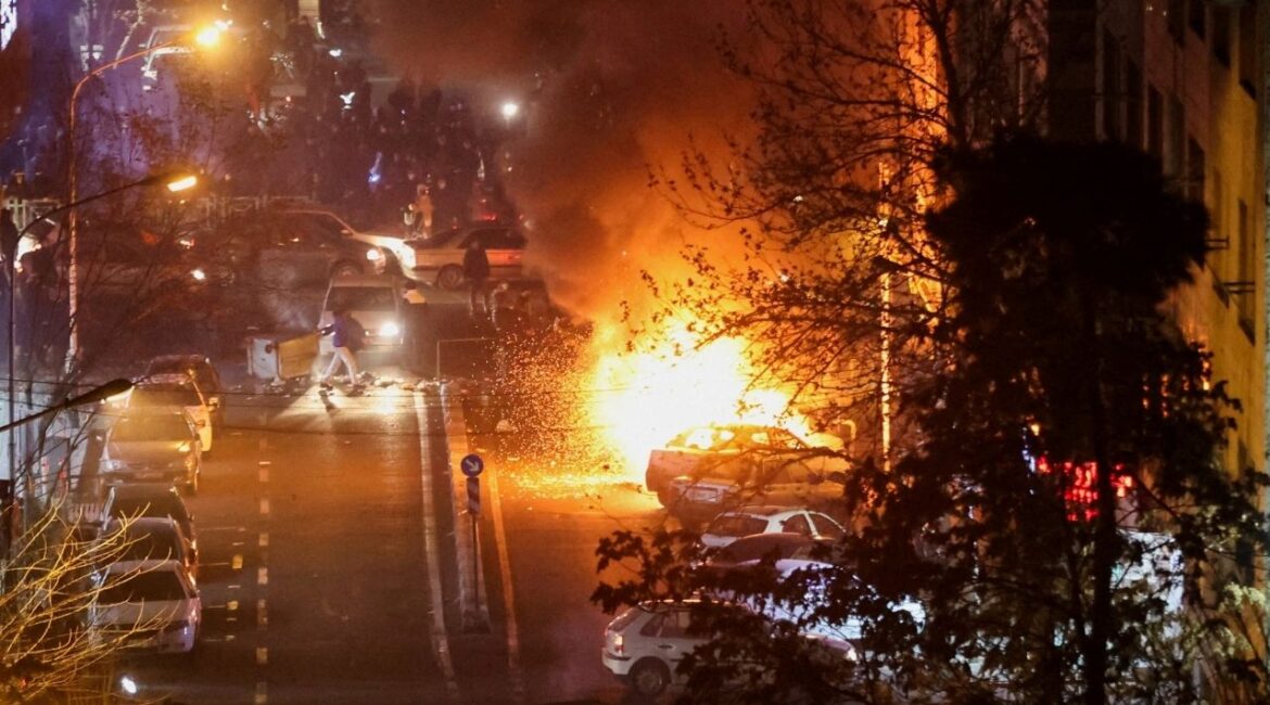 Cars burn in a street during a protest over the collapse of the currency's value, in Tehran, Iran, January 8, 2026. (Stringer/WANA (West Asia News Agency) via Reuters)