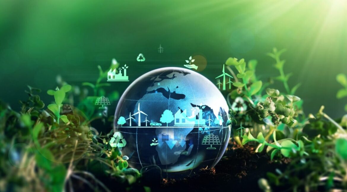 Conceptual image of climate projects to improve the world's environment. There is a blue-hued transparent globe superimposed on a green background