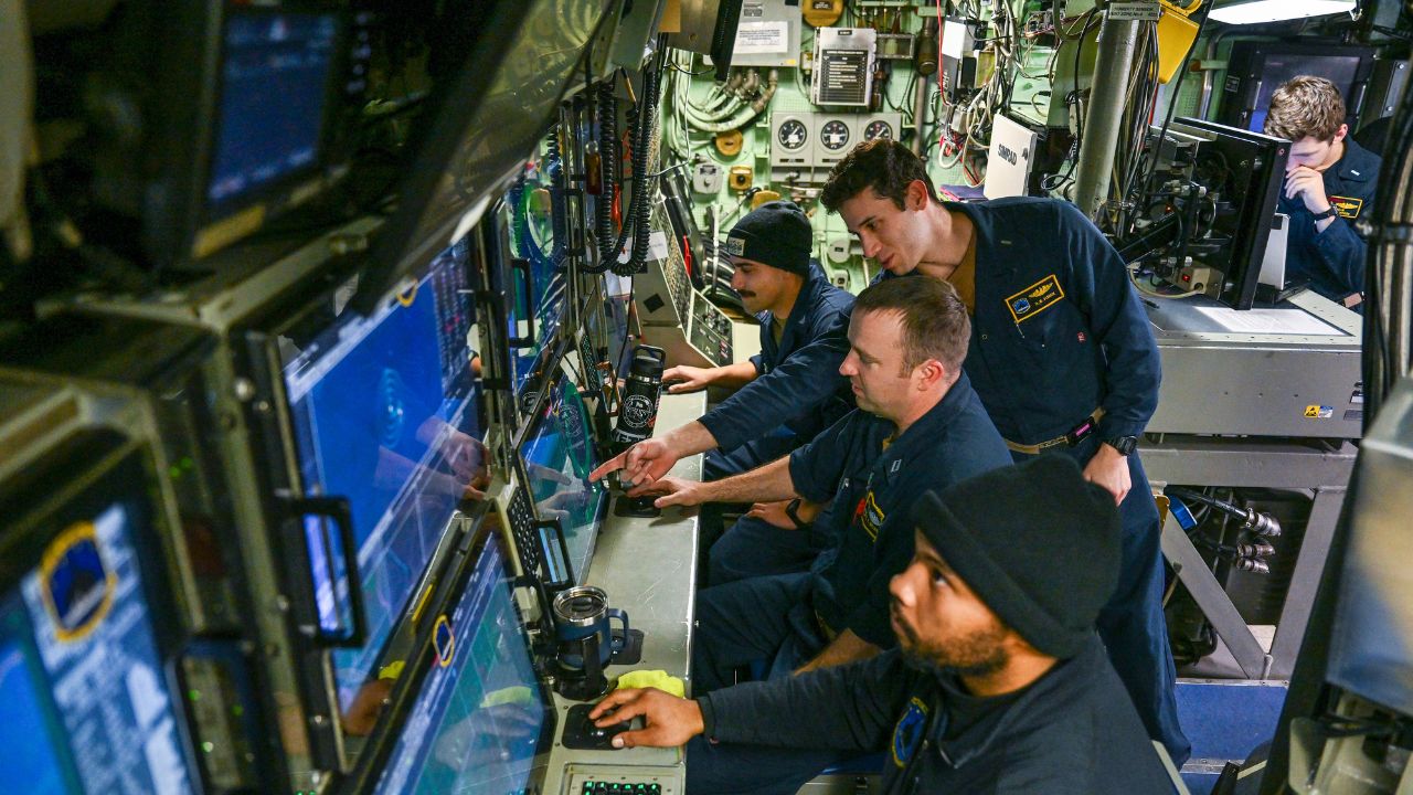 Crew abroad the USS Hampton at work during a deployment under the Arctic Ocean on March 17, 2024. The use of gunboats diplomacy faded heavily after World War II, but the practice of using navel force to bring an adversary to heel is as old as civilization itself. (Kenny Holston / The New York Times)