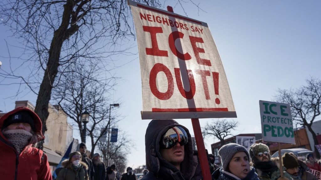 Demonstrators carry signs condemning Immigration and Customs Enforcement (ICE) near the site where a man identified as Alex Pretti was fatally shot by federal agents trying to detain him, in Minneapolis, Minnesota, U.S., January 24, 2026. (Reuters/Tim Evans)