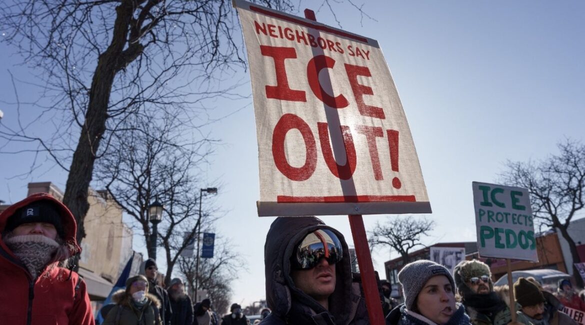 Demonstrators carry signs condemning Immigration and Customs Enforcement (ICE) near the site where a man identified as Alex Pretti was fatally shot by federal agents trying to detain him, in Minneapolis, Minnesota, U.S., January 24, 2026. (Reuters/Tim Evans)