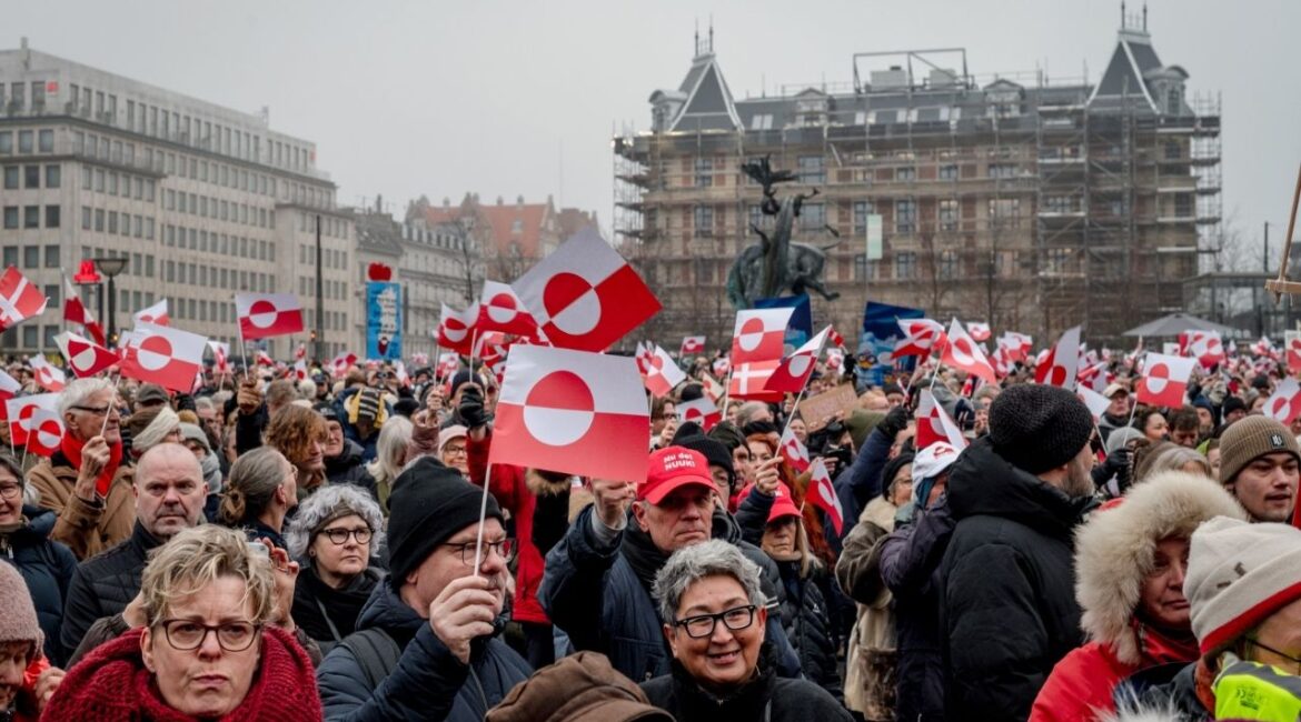 Demonstrators gather at City Hall in Copenhagen, Denmark, on Saturday, Jan. 20, 2026 to protest President Donald Trump’s designs on Greenland. Many in the crowd are waving the flag of Greenland. (Hilary Swift/The New York Times)