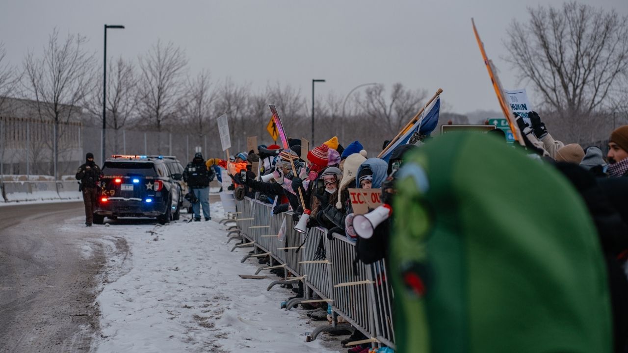 Demonstrators outside the Bishop Henry Whipple Federal Building near Minneapolis on Sunday, Jan. 18, 2026. Protesters interrupted a Sunday church service in St. Paul, Minn., over a pastor’s apparent work as an Immigration and Customs Enforcement official, escalating tensions between Minnesota residents and the Trump administration after an immigration agent shot and killed a woman in Minneapolis. (Jamie Kelter Davis for The New York Times)