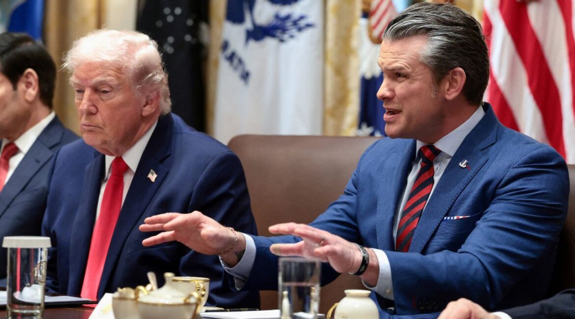 U.S. Defense Secretary Pete Hegseth speaks next to President Donald Trump during a cabinet meeting at the White House in Washington, D.C., U.S., January 29, 2026. (Reuters/Evelyn Hockstein/File Photo)