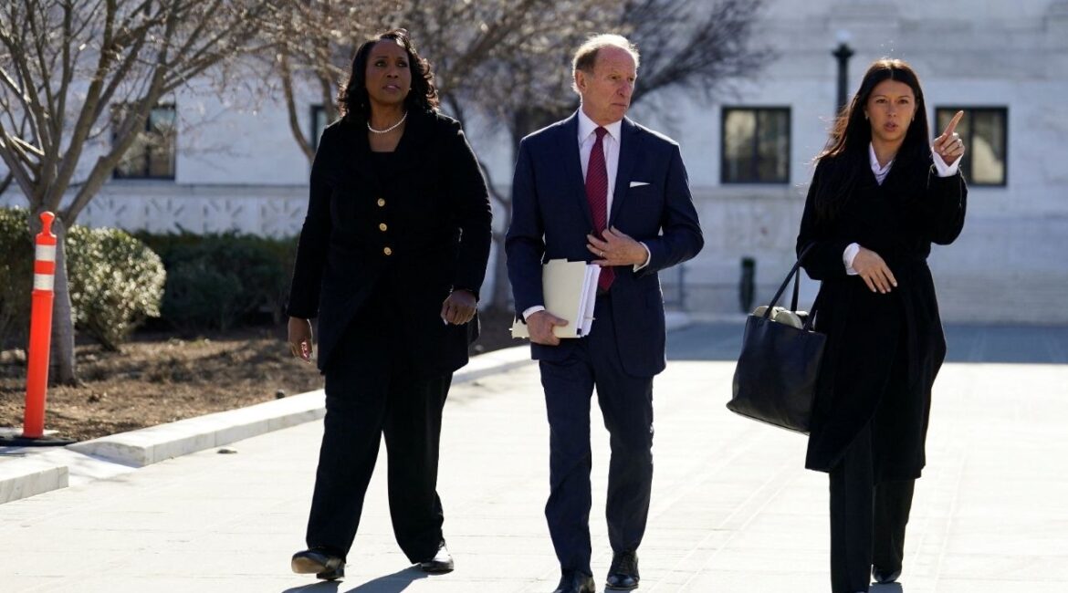 Federal Reserve Governor Lisa Cook, accompanied by lawyer Abbe Lowell, walks outside the U.S. Supreme Court, as Supreme Court justices consider U.S. President Donald Trump's effort to fire her, in Washington, D.C., U.S., January 21, 2026. (Reuters/Nathan Howard)
