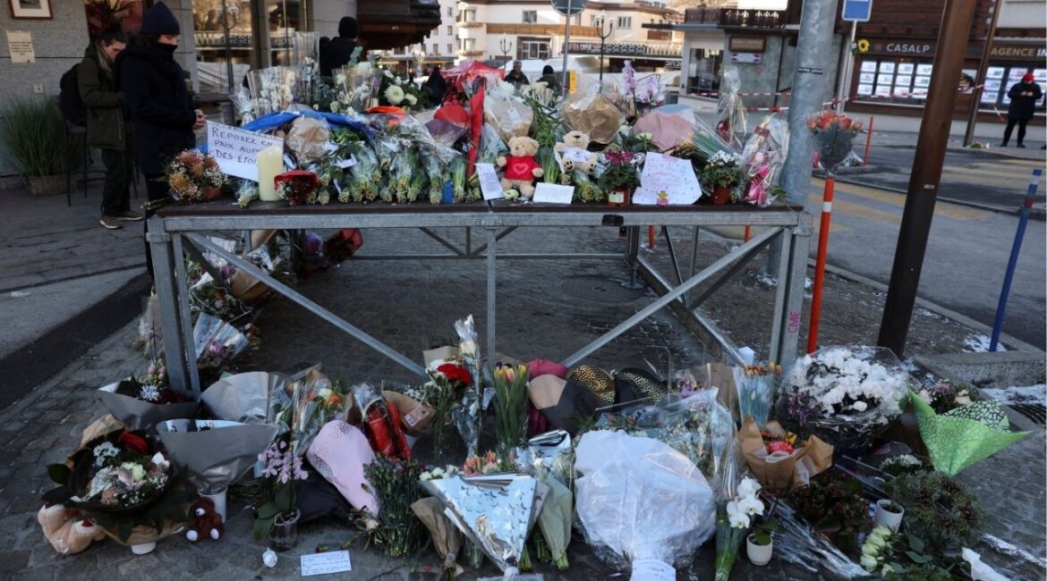 Floral tributes and stuffed teddy bears outside the "Le Constellation" bar, after a fire and explosion during a New Year's Eve party where several people died and others were injured, according to Swiss police, in the upscale ski resort of Crans-Montana in southwestern Switzerland, January 2, 2026. (Reuters/Stephanie Lecocq)
