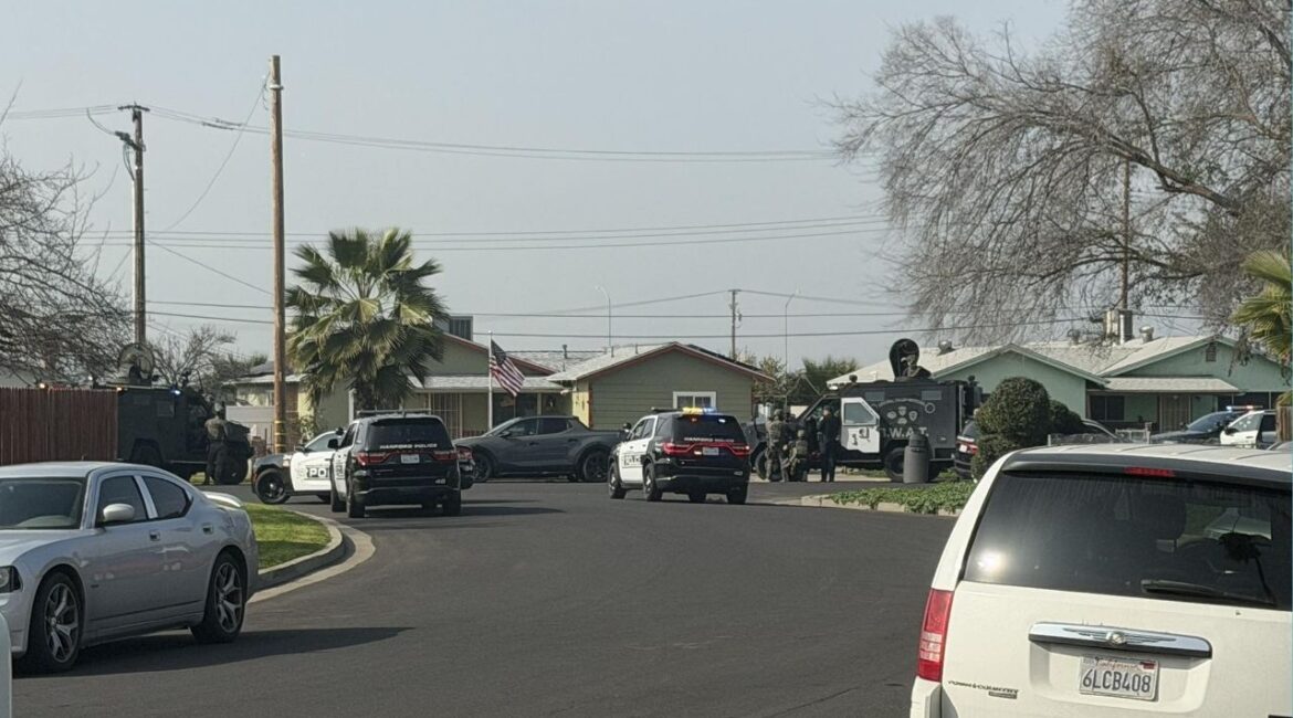 Hanford police and SWAT officers on Friday, Jan. 30, 2026, surrounded a home on Ogden Street after suspects shot and killed a 17-year-old at the Casa Del Sol Apartments earlier in the day. (City of Hanford)