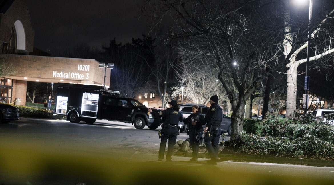 Police officers in the parking lot of a medical clinic in Portland, Oregon, where federal agents shot two people during a traffic stop, on Thursday, Jan. 8, 2026. The shooting in Portland was at least the 10th since September by federal agents who are part of the Trump administration’s immigration crackdown — and all involved people who were in their vehicles. (Jordan Gale/ The New York Times)