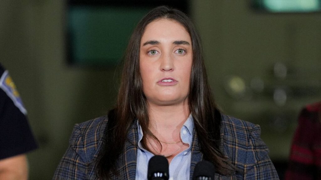 Immigration and Customs Enforcement (ICE) Deputy Director Madison Sheahan speaks during a press conference about 'Operation Midway Blitz', an immigration enforcement campaign, from a hangar in Gary, Indiana, U.S., October 30, 2025. (Reuters/Leah Millis)