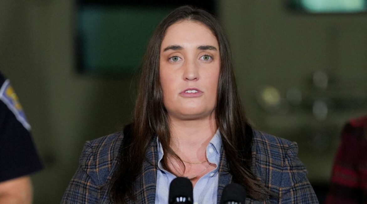 Immigration and Customs Enforcement (ICE) Deputy Director Madison Sheahan speaks during a press conference about 'Operation Midway Blitz', an immigration enforcement campaign, from a hangar in Gary, Indiana, U.S., October 30, 2025. (Reuters/Leah Millis)