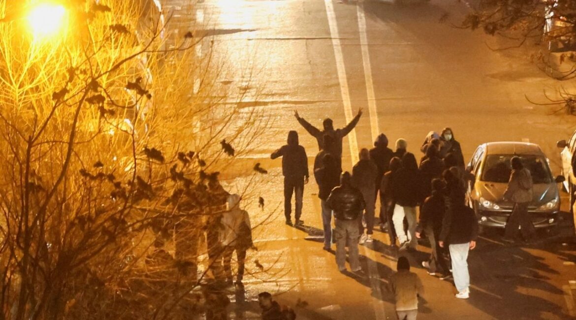 Iranian demonstrators gather in a street during a protest over the collapse of the currency's value, in Tehran, Iran, January 8, 2026. (Stringer/WANA (West Asia News Agency) via Reuters)