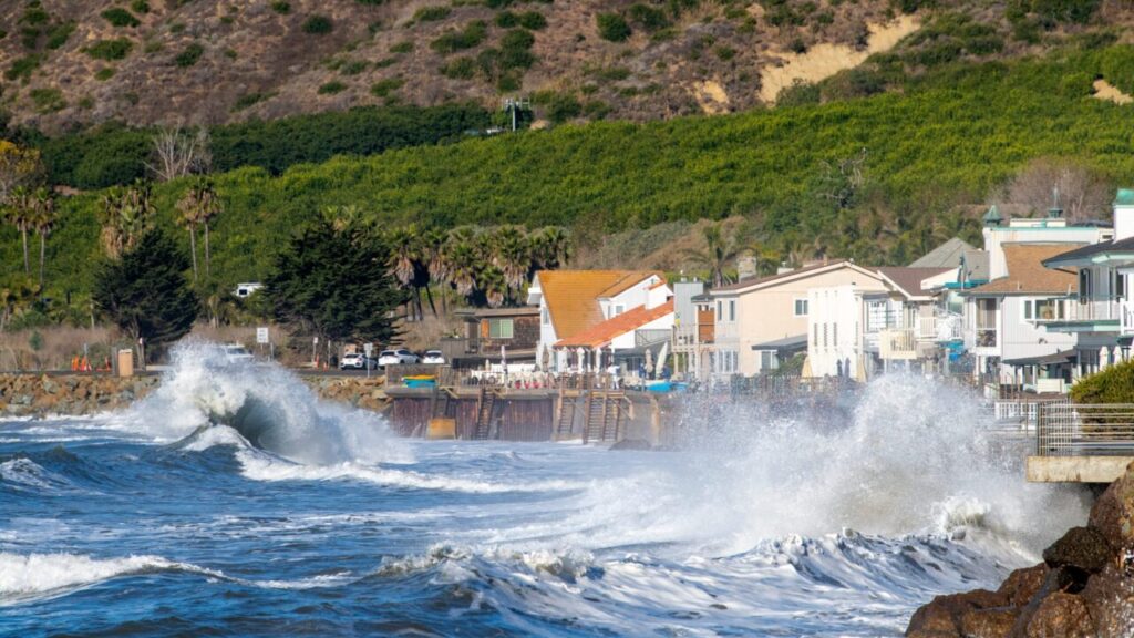 Image of king tides endangering homes on California's coastline.