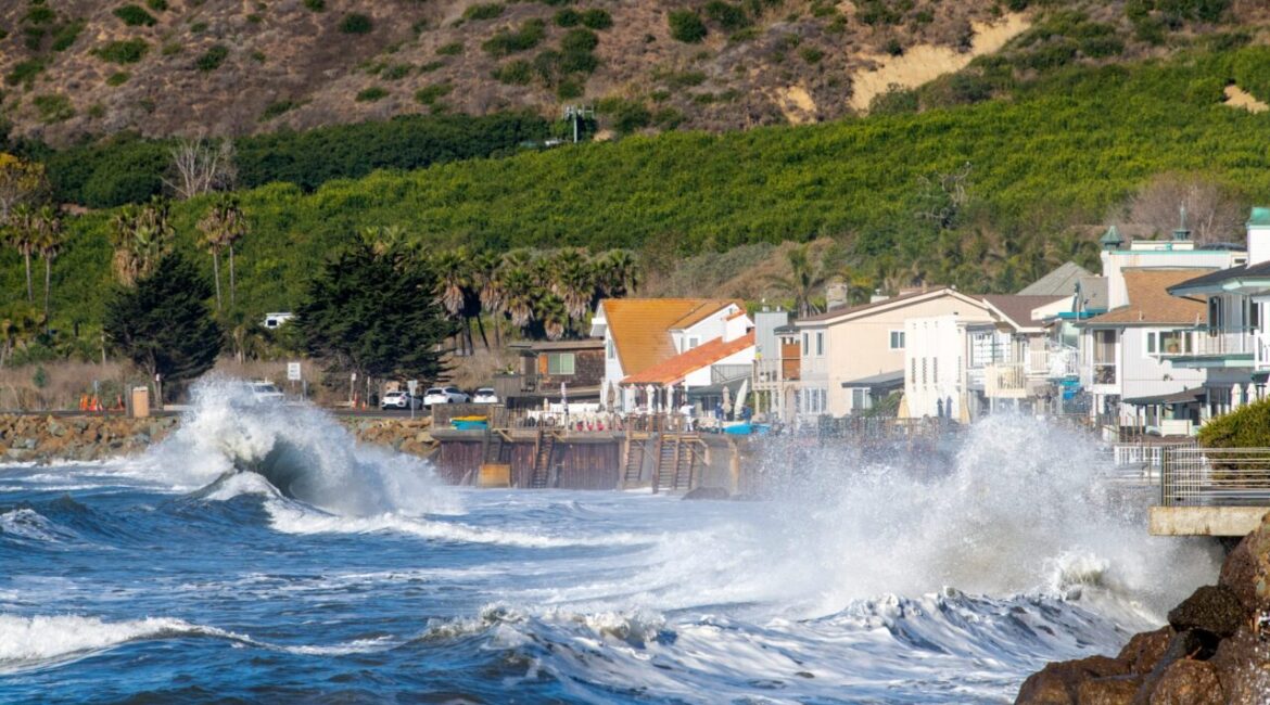 Image of king tides endangering homes on California's coastline.