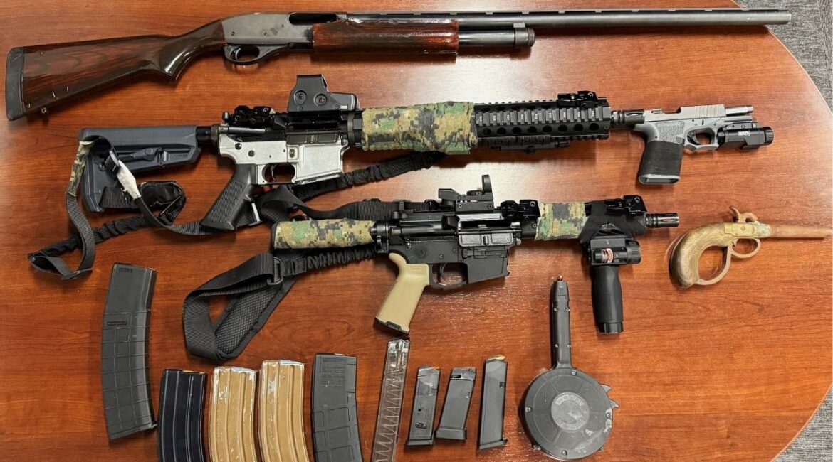 Madera police arrested Anthony Lopez, 28, and seized multiple firearms, including an assault rifle and an unregistered handgun, following a disturbance on Barnett Way where a gun was brandished. (Madera PD)