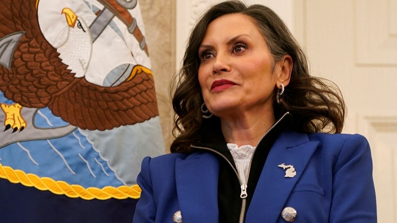 Michigan Governor Gretchen Whitmer stands, as U.S. President Donald Trump (not pictured) signs executive orders and proclamations, in the Oval Office at the White House in Washington, D.C., U.S., April 9, 2025. (Reuters/Nathan Howard)