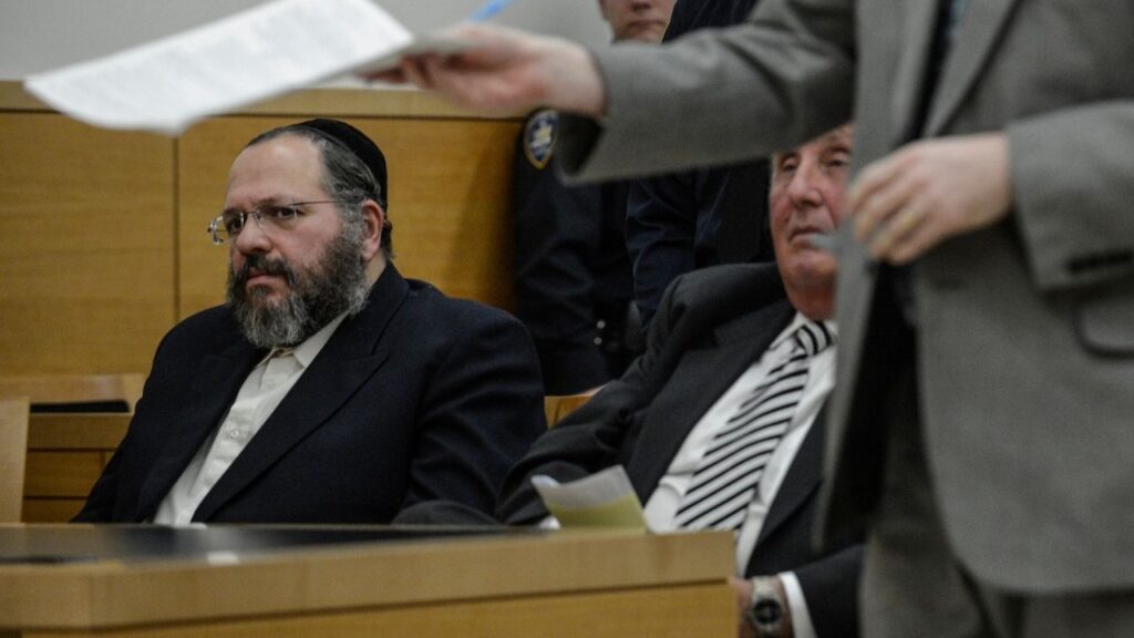 Nechemya Weberman sits in Brooklyn Supreme Court while the judge hands down a sentence of 103 years in New York, Jan. 22, 2013. Weberman’s sentence for child sexual abuse was reduced to 18 years, making him eligible for release within five years. He admitted his guilt for the first time on Tuesday. (Robert Stolarik/The New York Times)