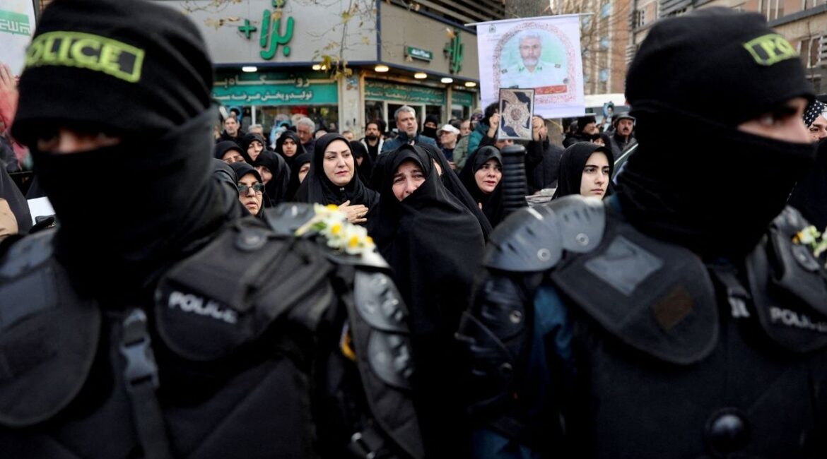 People attend the funeral of the security forces who were killed in the protests that erupted over the collapse of the currency's value in Tehran, Iran, January 14, 2026. (Reuters File)